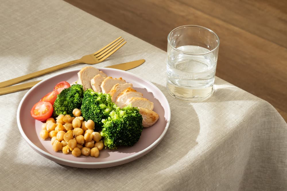 Dry Fasting vs Water Fasting: Is One Better Than Another? - high angle plate with keto diet food golden fork knife 2